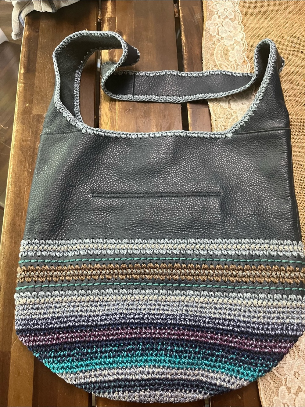 The Sak Black Shoulder Bag with Teal, Purple, Gray & Brown Crochet Stripes